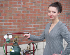 Attractive Woman using Multi-Purpose Sparkfree Antibacterial Wrench on tank's release valve